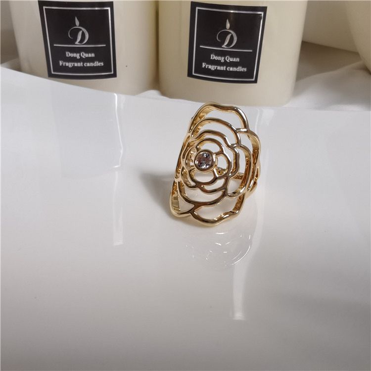 Curved floral design ring